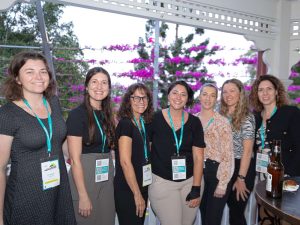 A group of women standing and smiling at the camera at the Networking Function, Change Conference